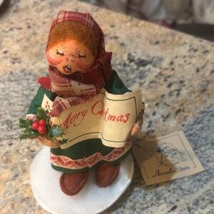Holiday Caroler Figurine with Plaid Scarf. Anna Lee figurine